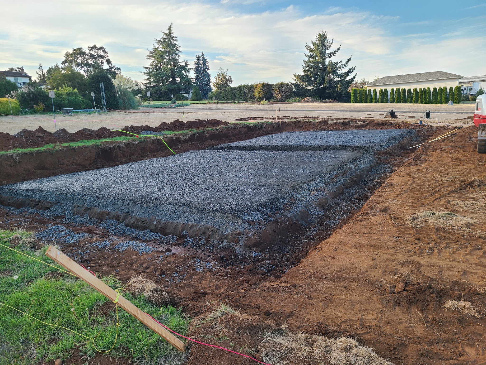 Excavated and graveled foundation base for a new build by Roth Construction